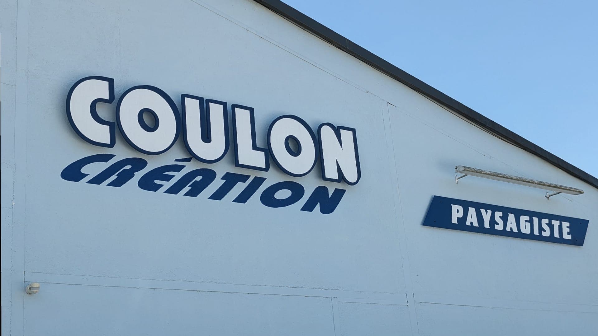 Enseigne Coulon Création, paysagiste à Dampierre-les-Bois